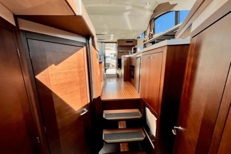  Yacht Photos Pics Luxurious interior of 2017 Galeon 380 Fly yacht with wooden cabinetry and modern design.