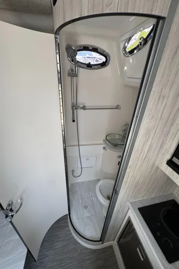 41-090 Yacht Photos Pics 2024 Regulator 41 boat bathroom with shower, sink, and modern fixtures.