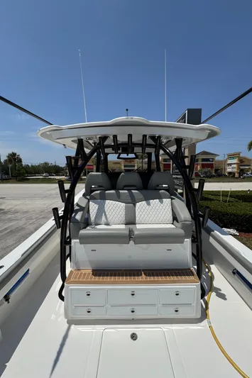 41-090 Yacht Photos Pics 2024 Regulator 41 boat interior with seating and storage under clear blue sky.
