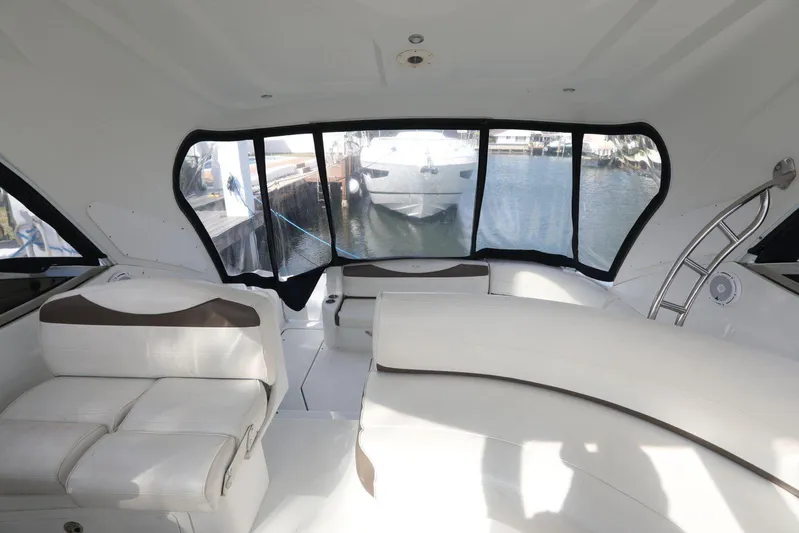  Yacht Photos Pics Interior of 2009 Cruisers Yachts 460 Express, featuring white seating and large windows.