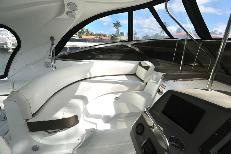  Yacht Photos Pics Interior of 2009 Cruisers Yachts 460 Express with sleek seating and modern dashboard.
