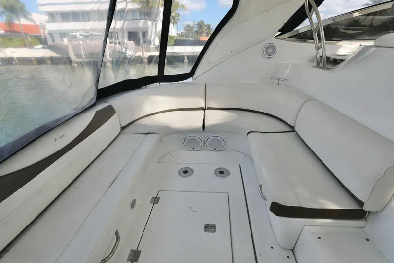  Yacht Photos Pics 2009 Cruisers Yachts 460 Express interior with white seating and waterfront view.