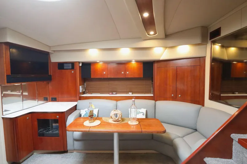  Yacht Photos Pics Luxurious 2009 Cruisers Yachts 460 Express interior with elegant wood finishes and cozy seating.