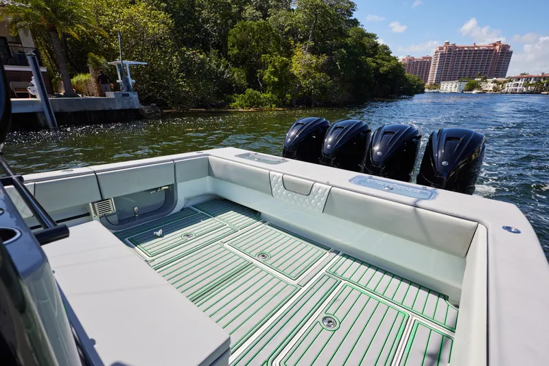  Yacht Photos Pics 2022 Contender 44 ST boat with four powerful engines on a scenic waterway.