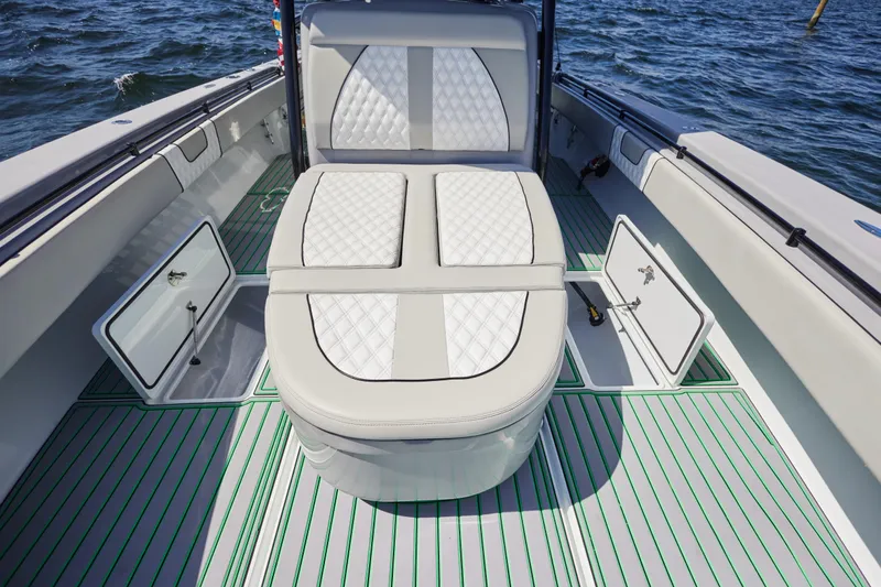  Yacht Photos Pics 2022 Contender 44 ST boat interior with cushioned seating and open storage compartments.