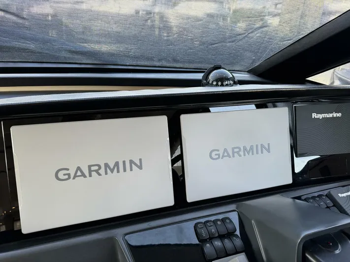 Above Deck Yacht Photos Pics Garmin and Raymarine navigation displays on 2018 Princess S60 yacht dashboard.