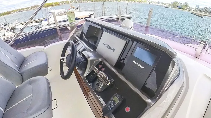Above Deck Yacht Photos Pics Helm of 2018 Princess S60 yacht with Garmin and Raymarine navigation systems.