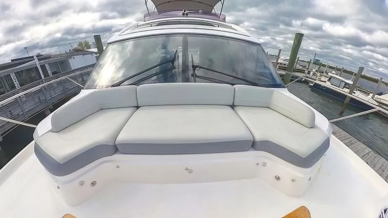 Above Deck Yacht Photos Pics 2018 Princess S60 yacht with spacious deck seating under cloudy skies.