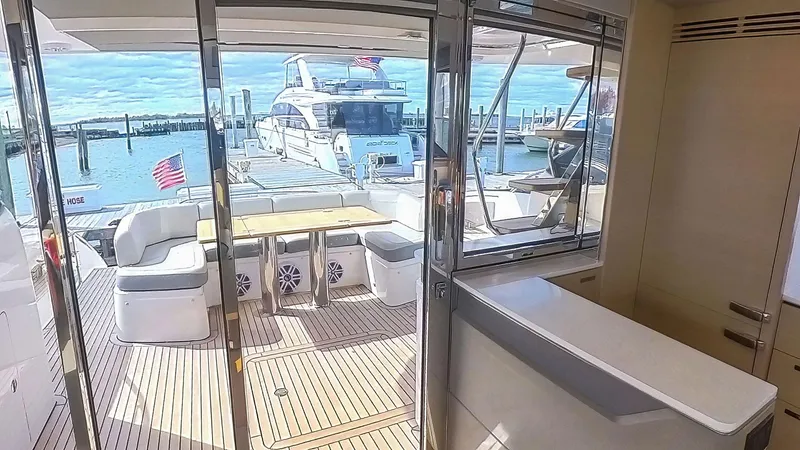 Above Deck Yacht Photos Pics Luxurious 2018 Princess S60 yacht interior with spacious deck and marina view.