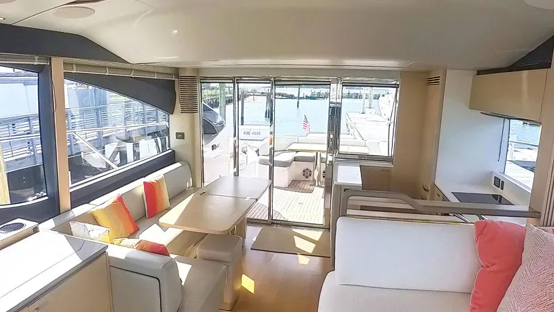 Above Deck Yacht Photos Pics Interior of 2018 Princess S60 yacht with modern seating and vibrant cushions.