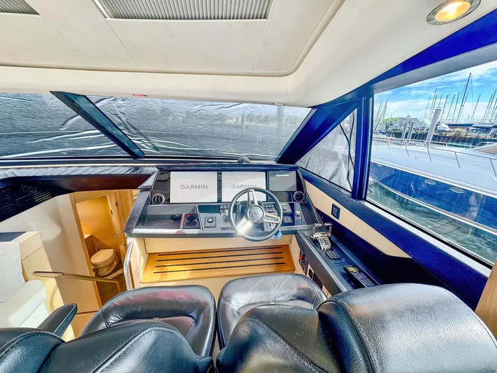 Above Deck Yacht Photos Pics Luxurious 2018 Princess S60 yacht helm with leather seating and advanced navigation systems.