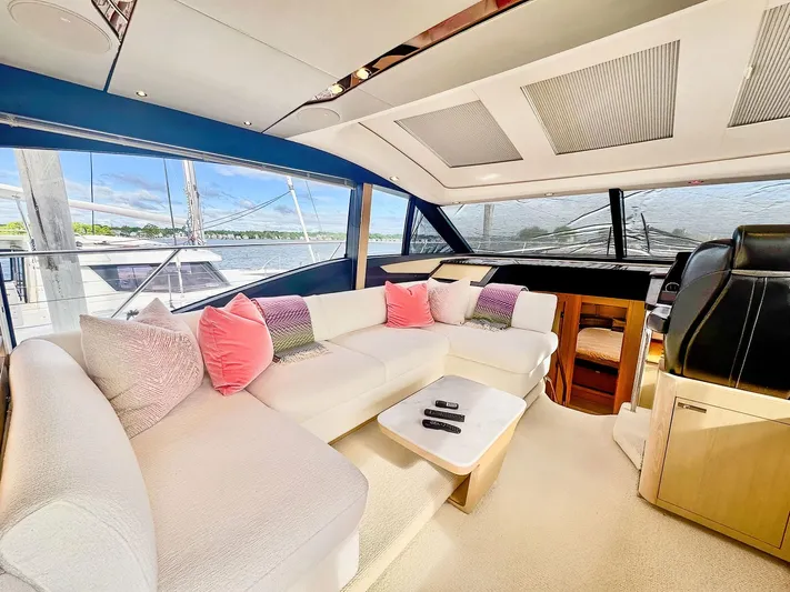 Above Deck Yacht Photos Pics Luxurious interior of a 2018 Princess S60 yacht with plush seating and modern design.