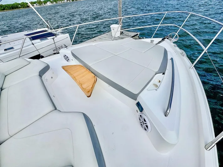 Above Deck Yacht Photos Pics 2018 Princess S60 yacht deck with cushioned seating and ocean view.