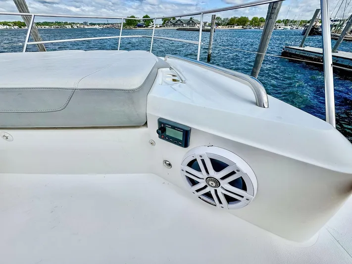 Above Deck Yacht Photos Pics Luxury 2018 Princess S60 yacht deck with speaker, overlooking serene marina waters.