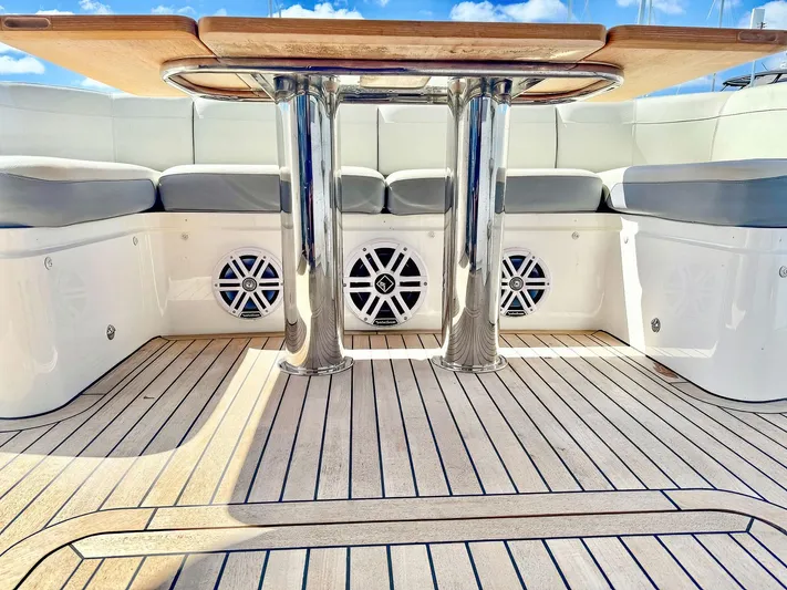 Above Deck Yacht Photos Pics Luxurious 2018 Princess S60 yacht deck with sleek seating and polished table.