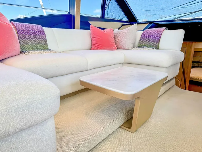 Above Deck Yacht Photos Pics Luxurious interior of 2018 Princess S60 yacht with plush seating and modern decor.