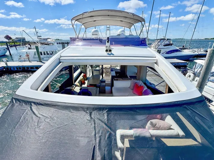 Above Deck Yacht Photos Pics Luxurious 2018 Princess S60 yacht docked, featuring spacious interior and elegant design.