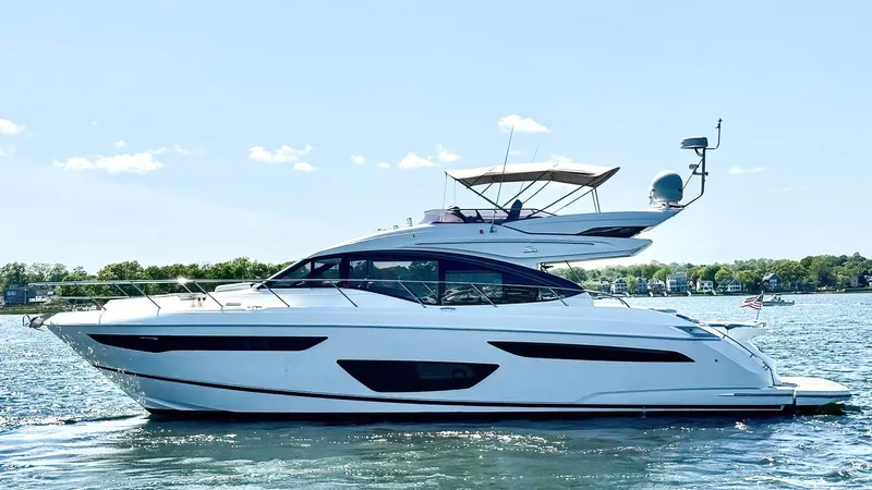 Above Deck Yacht Photos Pics 2018 Princess S60 yacht cruising on a sunny day, showcasing sleek design and luxury.