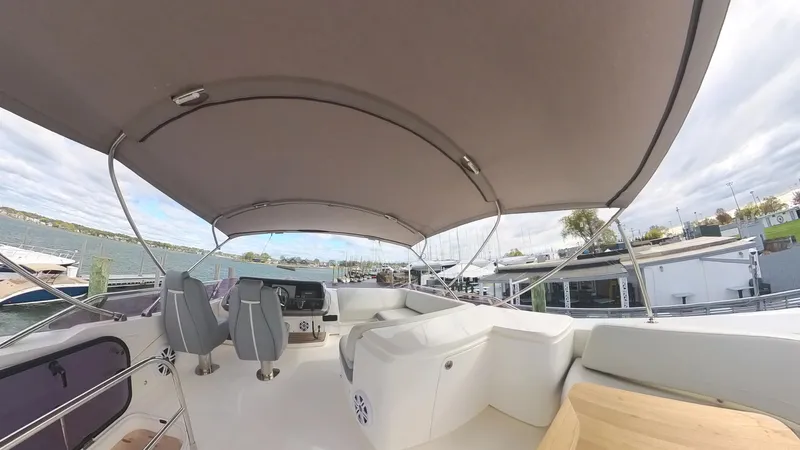 Above Deck Yacht Photos Pics 2018 Princess S60 yacht with spacious deck and canopy, docked at marina.