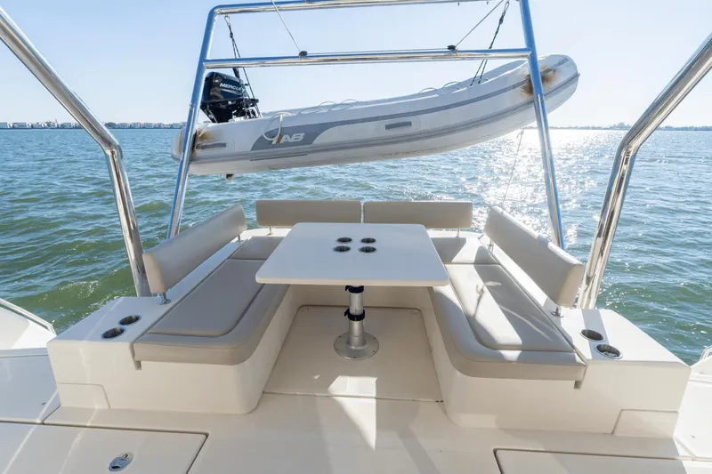 Cay Sera Yacht Photos Pics Aquila 44 Yacht 2019 with seating area and dinghy.