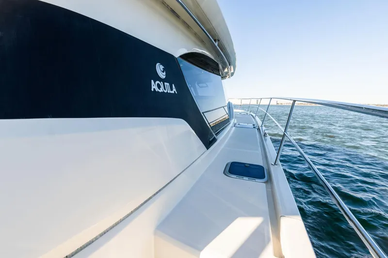 Cay Sera Yacht Photos Pics 2019 Aquila 44 yacht cruising on open water.