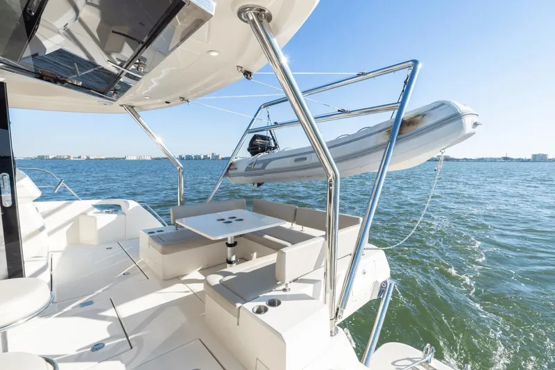 Cay Sera Yacht Photos Pics Aquila 44 Yacht 2019 with dinghy on open water.