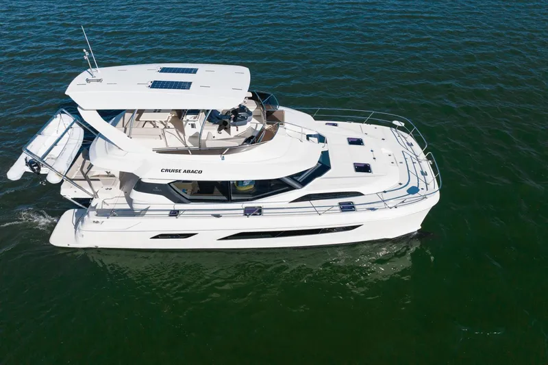 Cay Sera Yacht Photos Pics Aerial view of a 2019 Aquila 44 yacht on the water.