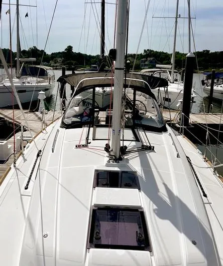 Odyssey Yacht Photos Pics 2022 Beneteau Oceanis 38.1 sailboat docked at marina, viewed from deck.