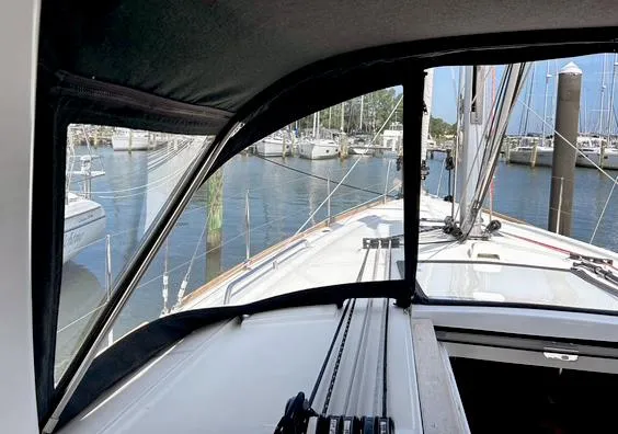 Odyssey Yacht Photos Pics Beneteau Oceanis 38.1 sailboat cockpit view, 2022 model, docked in a marina.
