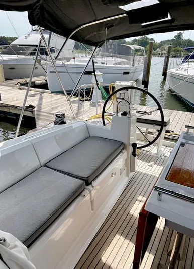 Odyssey Yacht Photos Pics Beneteau Oceanis 38.1 sailboat cockpit with seating, docked at marina, 2022 model.