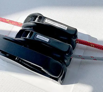 Odyssey Yacht Photos Pics Close-up of Beneteau Oceanis 38.1 sailboat rigging, featuring labeled spinnaker halyard and outhaul.