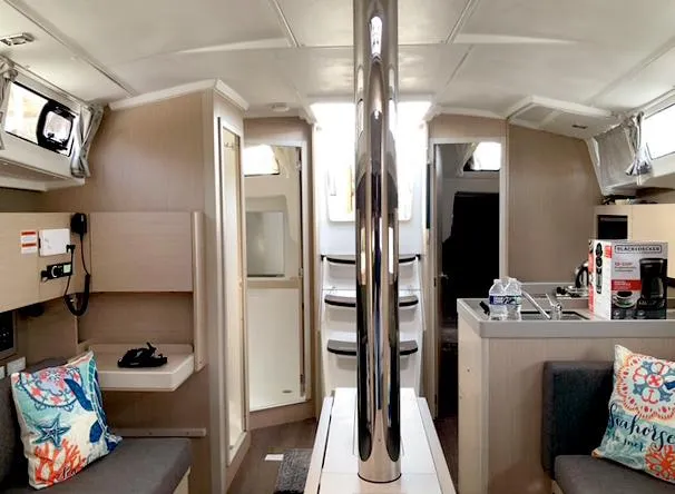 Odyssey Yacht Photos Pics Interior of 2022 Beneteau Oceanis 38.1 yacht, featuring modern design and cozy seating area.