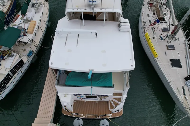 Jefferson Rivanna 50 Sdmy Yacht Photos Pics 2005 Jefferson Rivanna 50 SDMY yacht docked between two boats, aerial view.