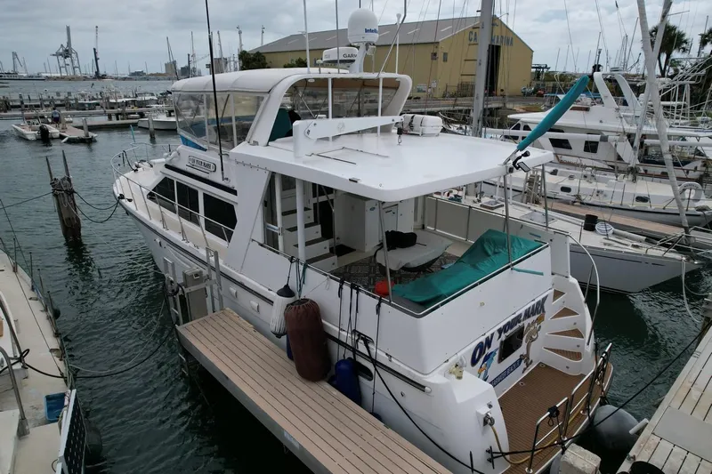Jefferson Rivanna 50 Sdmy Yacht Photos Pics 2005 Jefferson Rivanna 50 SDMY yacht docked at marina, surrounded by other boats.