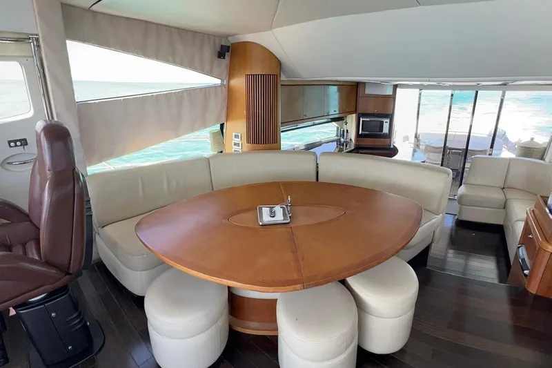  Yacht Photos Pics Luxurious interior of 2007 Sunseeker Manhattan 66 yacht with elegant seating and dining area.