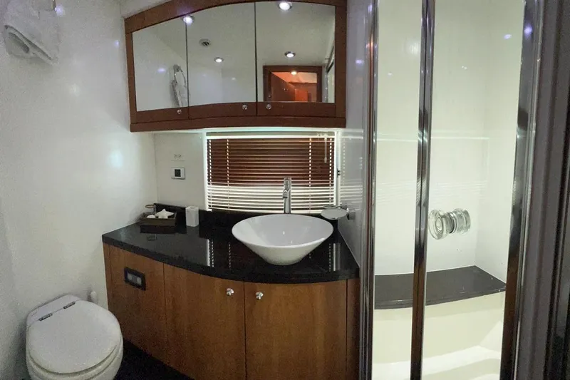  Yacht Photos Pics Luxurious bathroom in 2007 Sunseeker Manhattan 66 yacht with modern fixtures and elegant design.