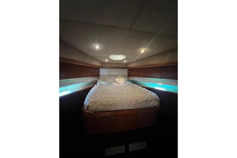  Yacht Photos Pics Luxurious bedroom interior of 2007 Sunseeker Manhattan 66 yacht with ambient lighting.