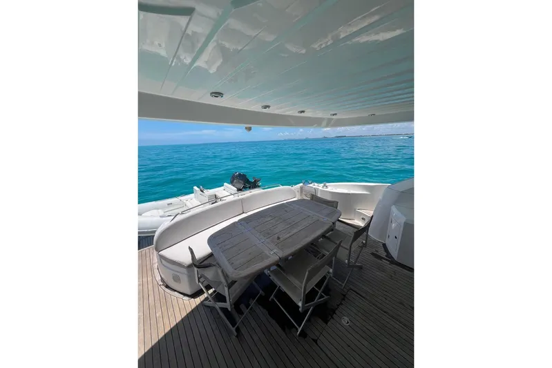  Yacht Photos Pics Sunseeker Manhattan 66 yacht deck with ocean view, featuring outdoor seating and table, 2007 model.