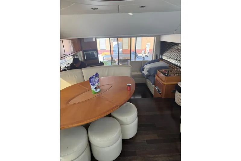  Yacht Photos Pics Interior of 2007 Sunseeker Manhattan 66 yacht with modern furnishings and dining area.