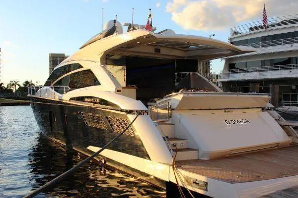  Yacht Photos Pics Luxurious 2012 Absolute 70 yacht docked at sunset, showcasing sleek design and elegance.