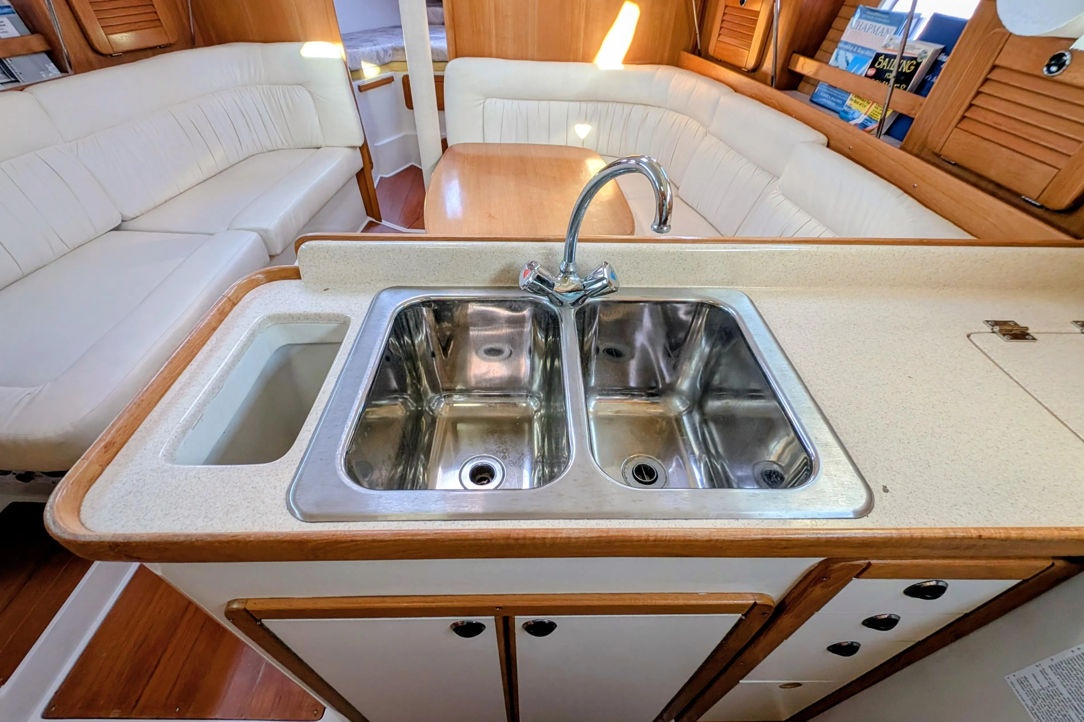 Interior of 2003 Catalina 34 MkII yacht with dual sink and seating area.