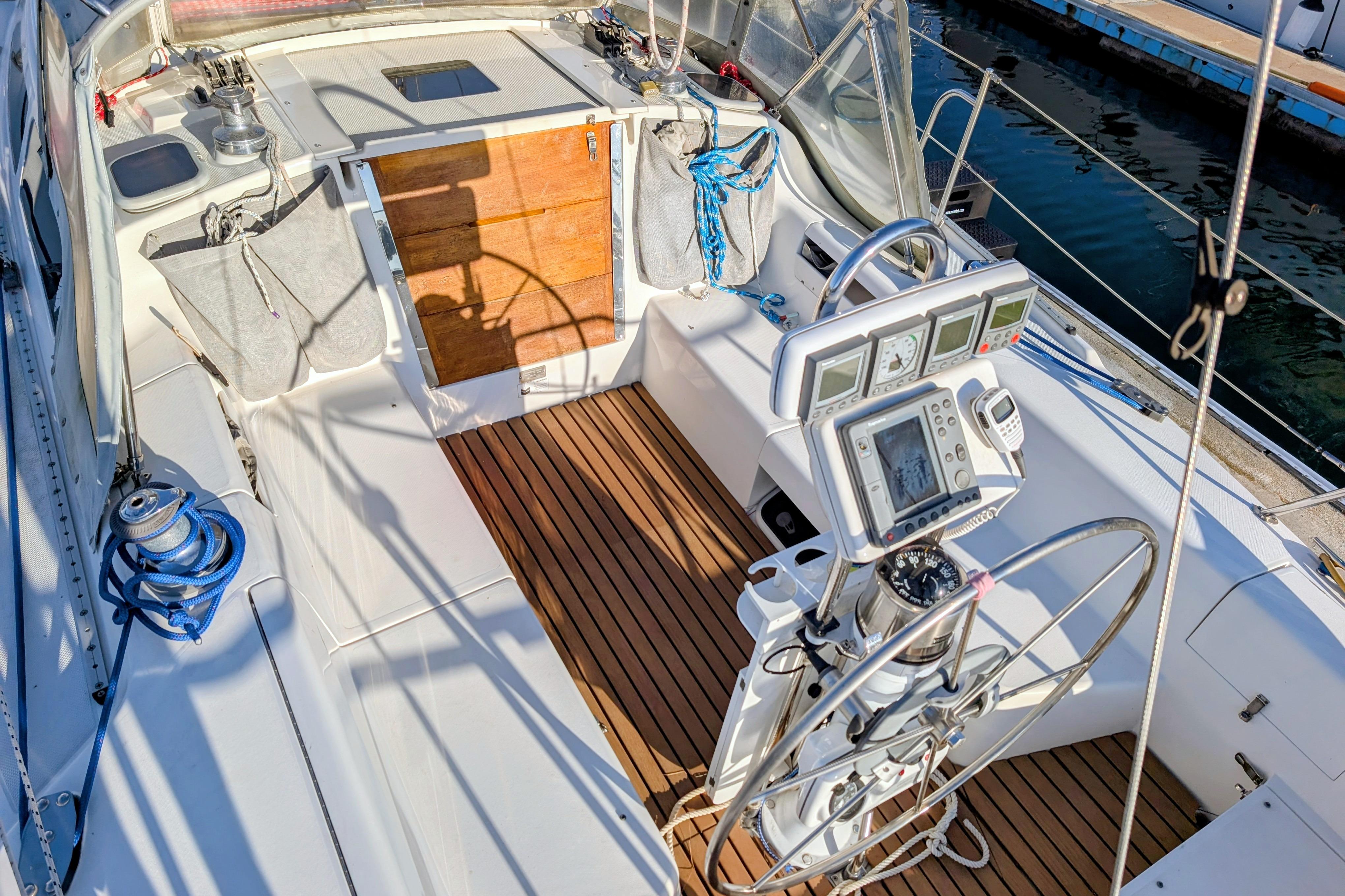 Cockpit of 2003 Catalina 34 MkII sailboat with navigation instruments and teak flooring.