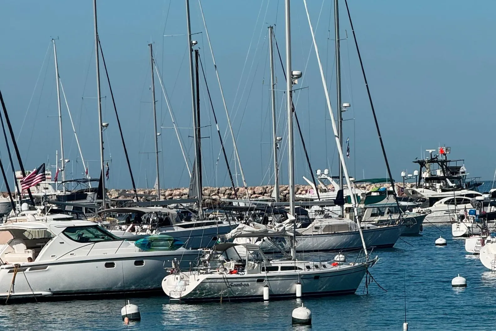 Boats docked in a marina, featuring a 2003 Catalina 34 MkII sailboat.