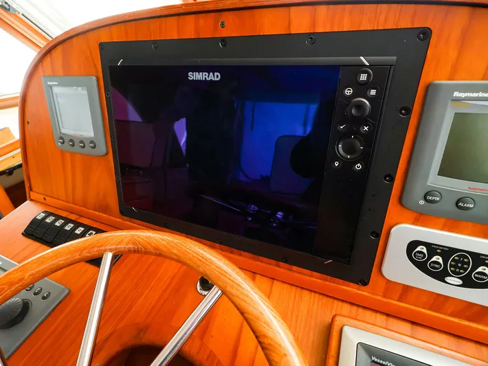 4814ak Yacht Photos Pics Control panel of a 2009 Legacy 32 boat with Simrad navigation system.