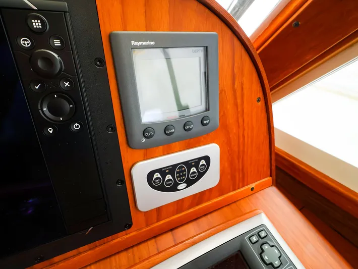 4814ak Yacht Photos Pics Boat dashboard with Raymarine display and control panel, Legacy 32, 2009 model.