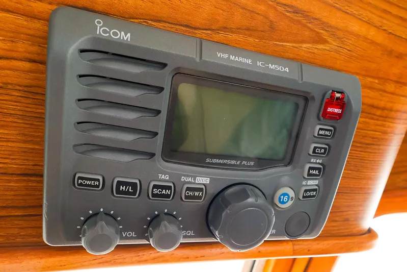 4814ak Yacht Photos Pics Icom VHF Marine IC-M504 radio on Legacy 32, 2009 model, mounted on wooden panel.