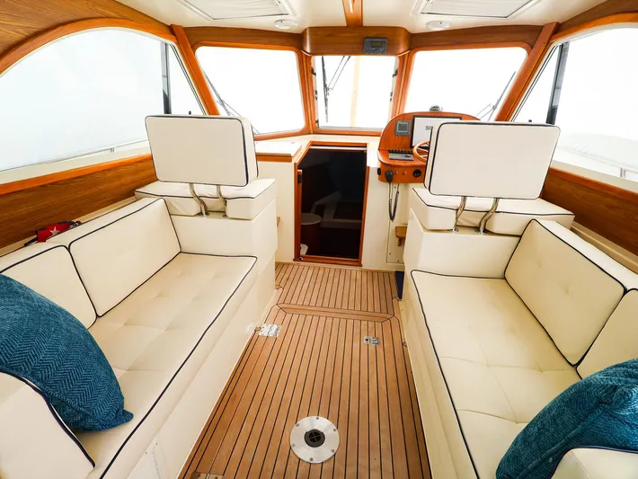 4814ak Yacht Photos Pics Luxurious interior of 2009 Legacy 32 boat with plush seating and wooden accents.