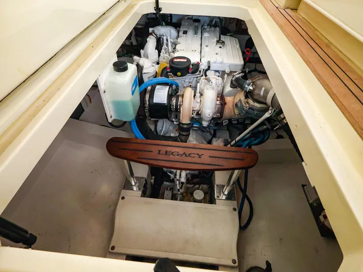 4814ak Yacht Photos Pics Engine compartment of a 2009 Legacy 32 boat, showcasing mechanical components and branding.