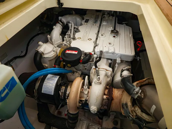 4814ak Yacht Photos Pics Engine compartment of a 2009 Legacy 32 boat, showcasing detailed mechanical components.