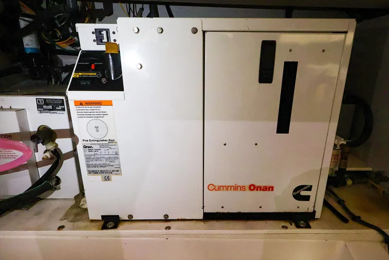 4814ak Yacht Photos Pics Cummins Onan generator in a Legacy 32, 2009 model, installed in an engine compartment.